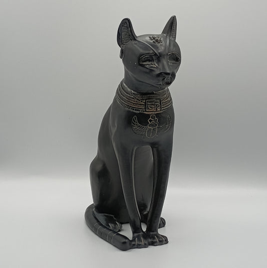 Bastet, Black cat statue with decorative collar on a gray background