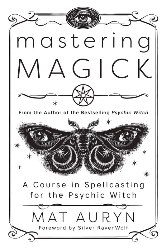 The white cover of Mastering Magic by Mat Auryn, A Course in Spellcasting for the Psychic Witch, with a stylized moth (with eyes in wings)